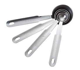 Set of metal measuring spoons of different sizes. Isolated on white background.