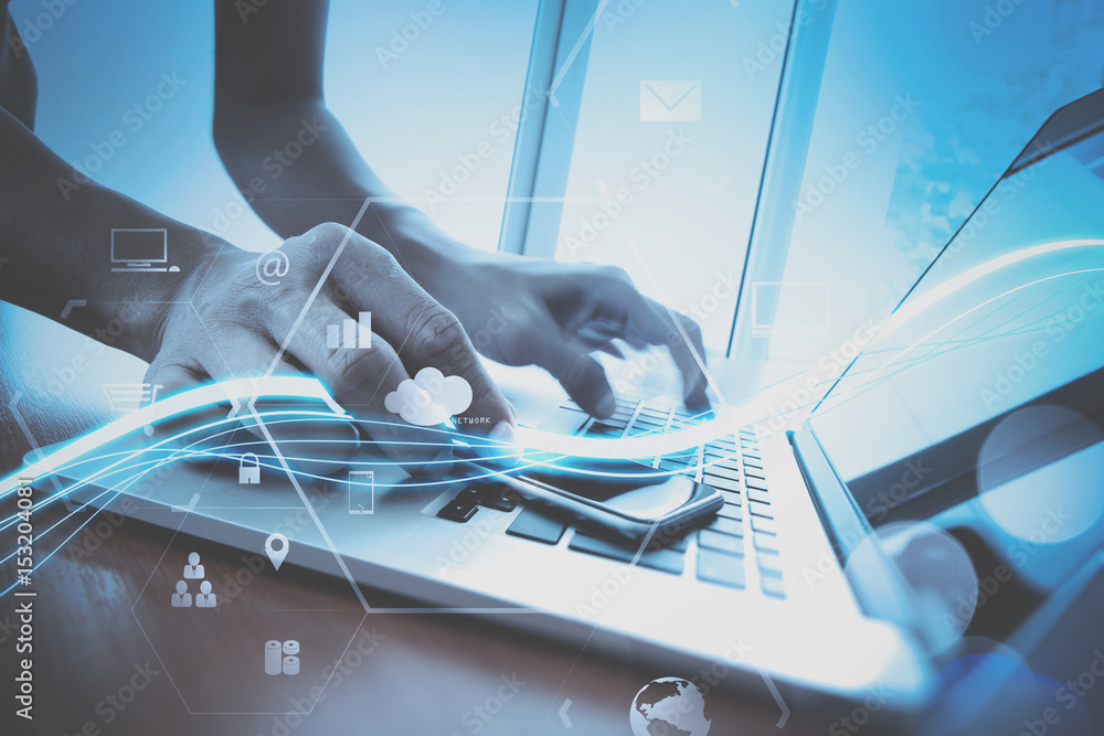 Aufkleber businessman working with mobile phone and digital tablet and laptop computer on wooden desk in modern office with VR icon and chart diagram