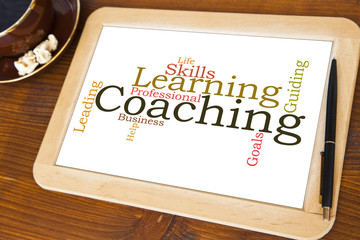 blackboard with coaching word cloud