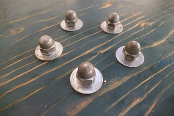 Fototapeta na wymiar detail od round screws on a table desk