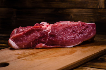 Raw pork meat on cutting board