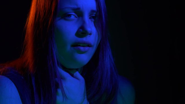 Scared teen girl with in dark