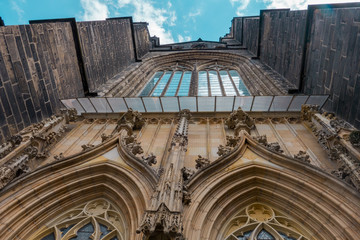 The front of the gothic cathedral stretching to the sky. Illuminated and colorful cathedral in Swidnica in Poland.