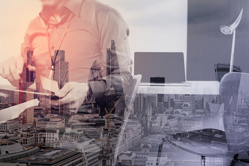businessman working with mobile phone and digital tablet and laptop computer on wooden desk in modern office with virtual icon diagram