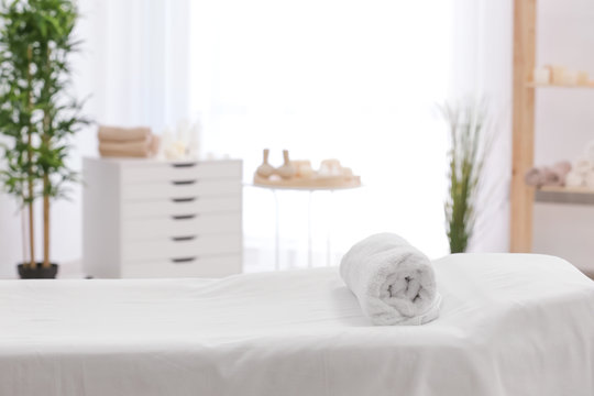 Towel on massage table in modern spa salon Stock Photo | Adobe Stock