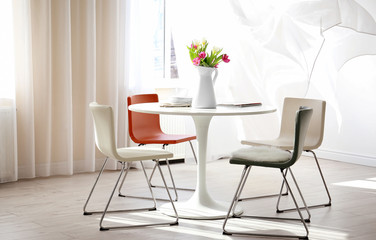 Modern living room with table and chairs