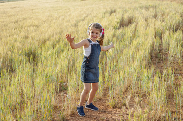 girl Listening to music with headphones in the countryside