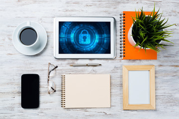 Web security and technology concept with tablet pc on wooden table