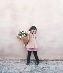 Young girl with bouquet of flowers