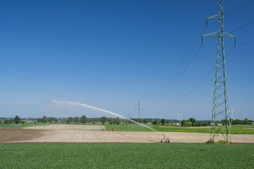 Irrigation of fields during a dry season. 