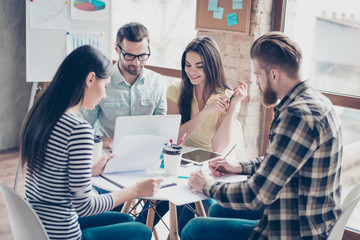 Self development seminar training of young business people in modern work station. They are start up partners, working on new concept