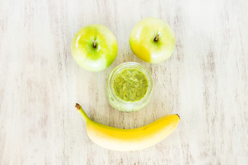 Green Spinach Smoothie With Apples And Banana Smiley Face