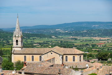 Fototapeta na wymiar France, Gordes, Provence, Church spire overlooking the valley below.