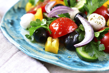 Fototapeta na wymiar Fresh vegetable salad with mozzarella cheese.
