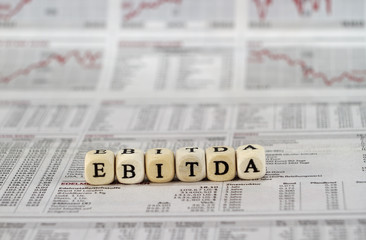 EBITDA word built with letter cubes