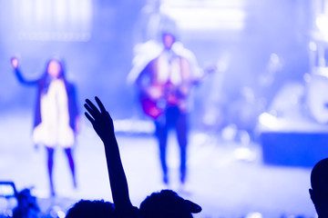 Woman raising arm in modern church