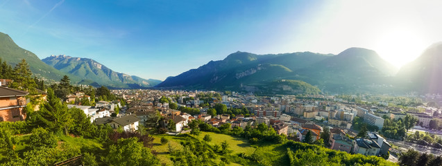 Fototapeta na wymiar Wide panorama of mountain town during golden hour