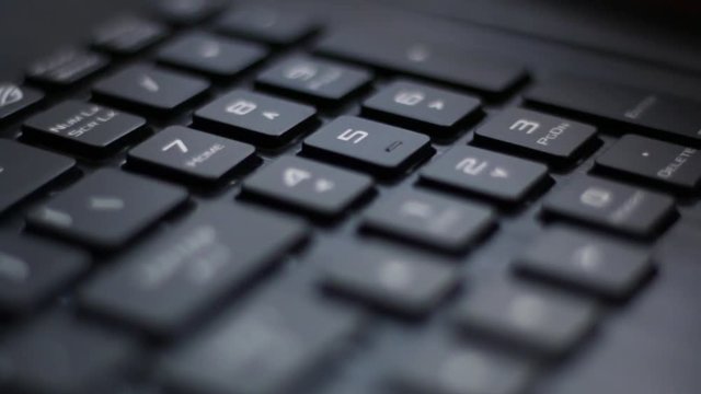 Number pad Angle B of back lit laptop keyboard with red nahimic RGB keys flashing side to side