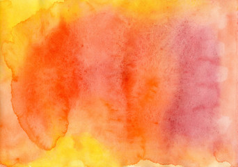 Background in orange and yellow tones painted in watercolor by hand on wet textured paper