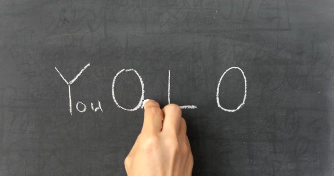 Chalk writing - You Only Live Once on chalkboard 