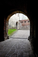 Medieval stone entrance gate to the Benedictine monastery in Tyniec