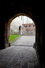 Fototapeta premium Medieval stone entrance gate to the Benedictine monastery in Tyniec