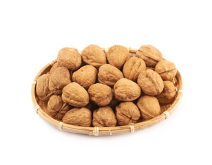 Wicker basket of walnuts isolated