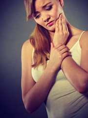 Fototapeta premium Woman suffering from tooth pain