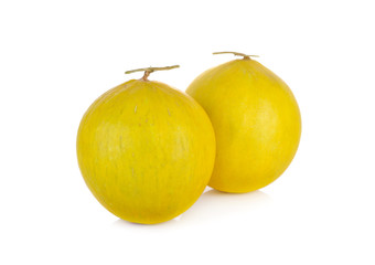 whole fresh yellow melon with stem on white background
