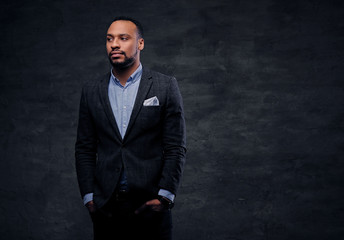 Studio portrait of elegant black male dressed in a suit.