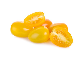 whole and half cut yellow cherry tomato on white background
