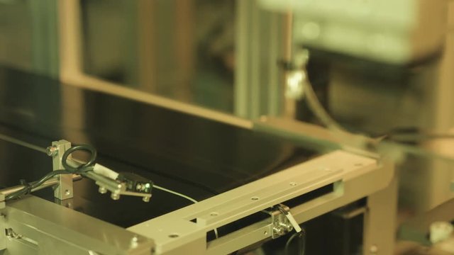Large Touch Screen Panel of Mobile Phone.
Close up of the production line of large touch screen LCD module transporting one by one.
