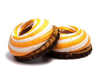 Pile of marshmallows glazed with chocolate. Many coated elegant zephyr dessert isolated on white. Sweet elegant dessert on a plate