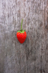 Fresh strawberry on wooden background. 