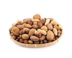 Wicker basket full of nuts isolated