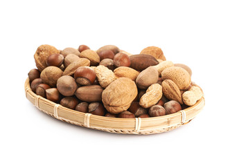 Wicker basket full of nuts isolated