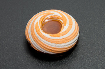 Pile of marshmallows glazed with chocolate. Many coated elegant zephyr dessert isolated on white. Sweet elegant dessert on a plate