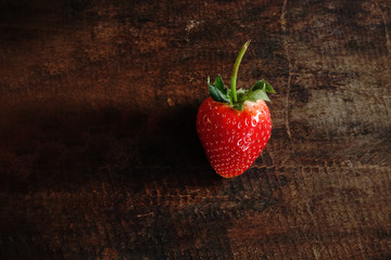 Fresh strawberry on wooden background. 
