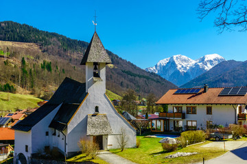 Fototapeta na wymiar Mountain landscape and church Zum Guten Hirten by Ramsau in Bavaria