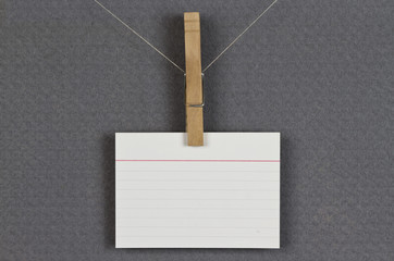 blank card pinned up on a pinboard
