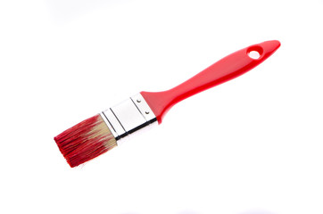 Red brush in red paint