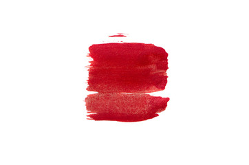 Smear of red paint on white background