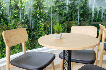 Table with chairs decorative garden in coffee shop
