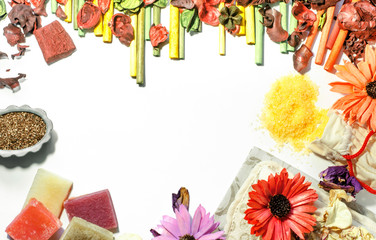 Beauty salon accessories, flat lay design background. Soap, bath salt, washcloth, flower petals, and aroma incense. Top view.