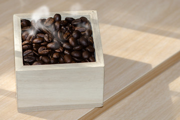 roasted coffee beans in the wood box.