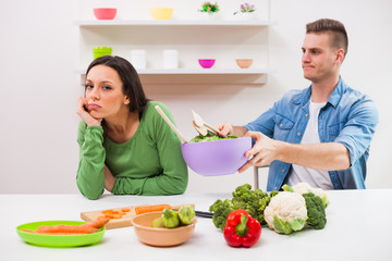 Woman is tired of cooking.