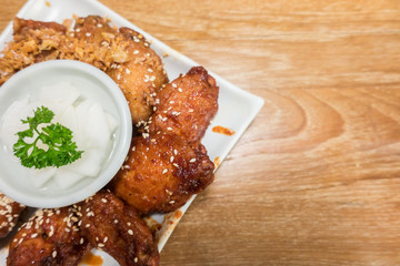 Korean style spicy sauce deep fried chicken wing serve ..top view with copy space.selective focus