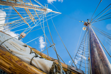 Fototapeta premium Folded sail and mast on an old sailboat