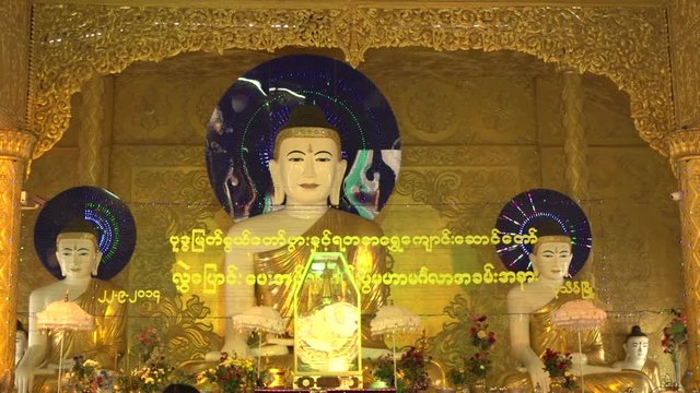 Pathein, People pray to Buddha statue At The Shwemokehtaw Pagoda