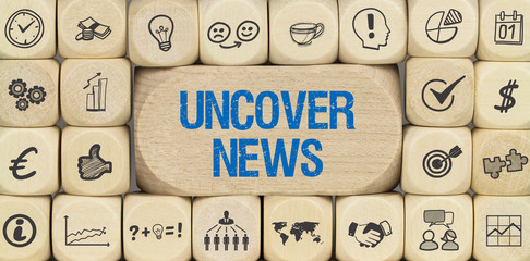 Uncover News / Würfel mit Symbole